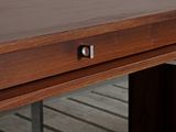 a wooden table with a drawer on top of it