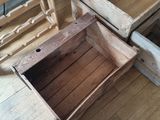 two wooden crates sitting next to each other on the floor