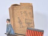toy figurine of a man pulling a cart with a horse drawn carriage