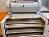 une image représentant une machine servant à fabriquer du papier