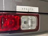 a close up of a car ' s tail light with a vpauto sticker on it