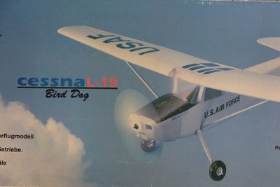 a box with a picture of a small plane in the sky