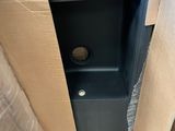 a box that has a toilet inside of it