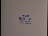 photograph of a white book with blue writing on the cover