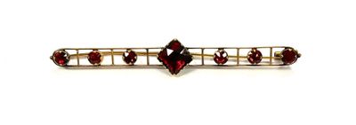 an image of a close up of a hair pin with red stones