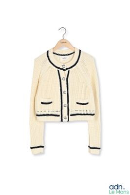 cream cardigan sweater with black trim and buttons