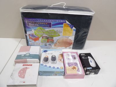 a box of baby products sitting on a table next to other items