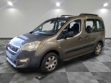 the small van is parked in a large room with a checkered floor