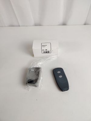 a remote control and a cell phone on a white table