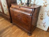 a wooden desk with a lamp on top of it