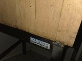 a wooden table with a sign on it in a room