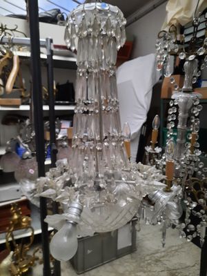 a glass chandelier that is sitting on a table