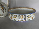 a white bowl with a blue rim sitting next to a white bowl with a blue rim