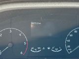 a close up of a car dashboard with a speedometer and gauges
