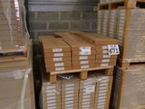 several stacks of cardboard boxes stacked on top of each other in a warehouse