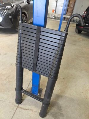 an image of a car being serviced at a service station