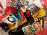 a pile of toys and games in a plastic container