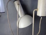 two lamps that are on the wall next to each other