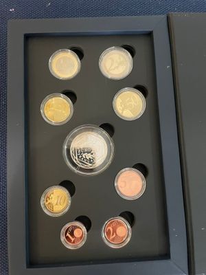 an image of a picture of a set of coins in a box