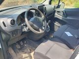the interior of a small car with a steering wheel and dashboard