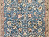 a blue rug with a floral design on it