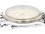 a close up of a watch with a chain around it