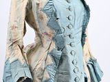 an image of a woman ' s jacket with ruffles on it