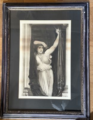 an old picture of a woman in a hat is hanging on a wall