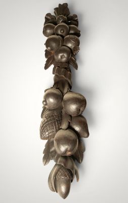 a wall hanging made of spoons and spoons on a wall