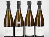 trois bouteilles de vin posées l'une à côté de l'autre sur une table