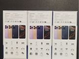 three new iphones are sitting on a table in front of a box
