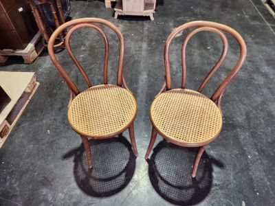 two chairs that are sitting next to each other on the floor