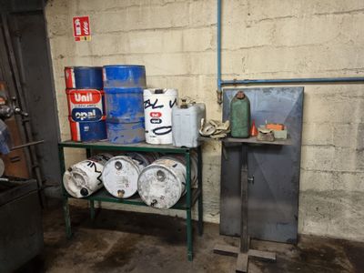 a room with several barrels of beer on a shelf