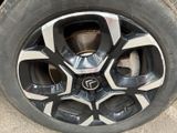 the tire of a car with a flat tire on the ground