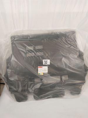a bag of luggage sitting on a bed in a room