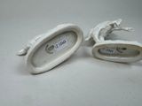 pair of white porcelain figurines of a horse and a bird
