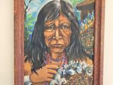 painting of a native woman holding a kitten in her arms