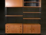 a wooden bookcase with two drawers and a shelf with glass doors