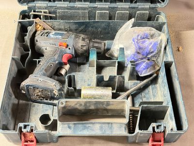 a tool box with tools in it sitting on a table