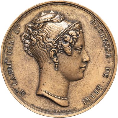 an old coin with a woman ' s head and a crown on it