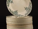 many plates stacked on top of each other on a black surface