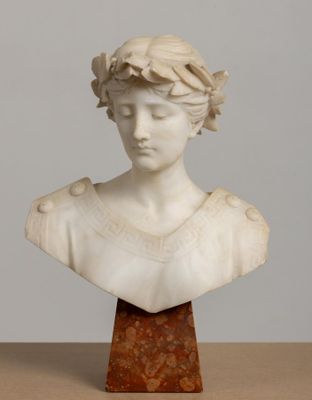 marble bust of a woman with a wreath of flowers on her head