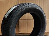 tires are stacked on a cardboard box in a warehouse