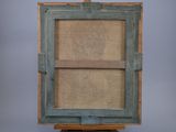 an old wooden easel with a piece of burlock on top of it