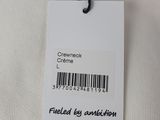 the label on a white shirt is attached to a black cord