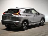 the rear end of a silver honda hrx parked in a garage