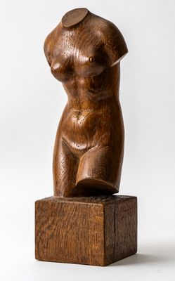 an image of a wooden sculpture of a woman on a wooden block
