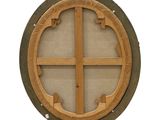 a round window with a wooden frame on a wall