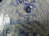 a close up of a blue vase with the word france on it