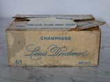 a box of champagne sitting on a marble table